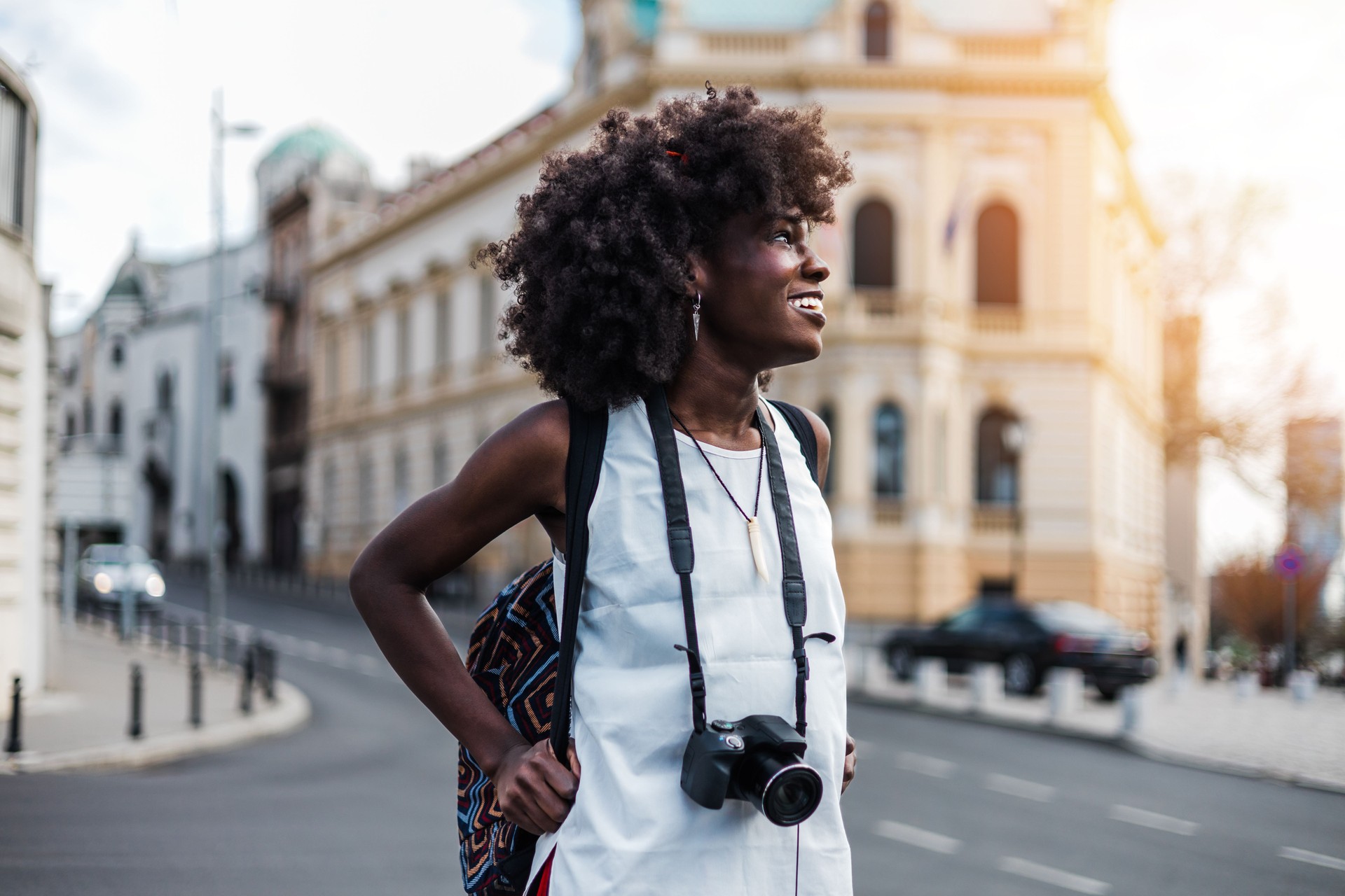 Black female tourist on city street